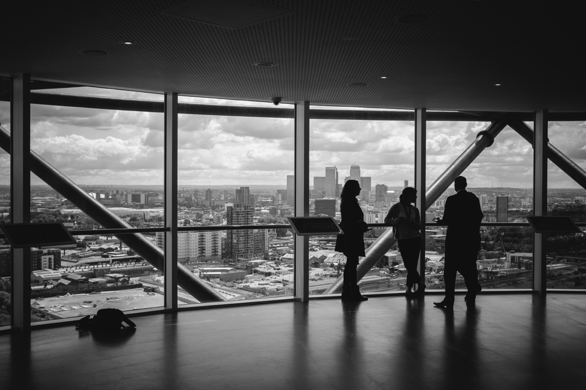 People overlooking a distribution cityscape